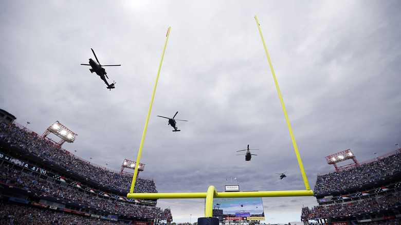 A helicopter flyover before the game between the New Orleans Saints and the Tennessee Titans at Nissan Stadium on November 14, 2021 in Nashville, Tennessee.