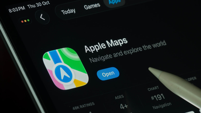 Dhaka, Bangladesh- 30 Oct 2025: Apple Maps app displayed on a iPad screen in dark mode with a digital pen pointing at it.  by: Bangla press