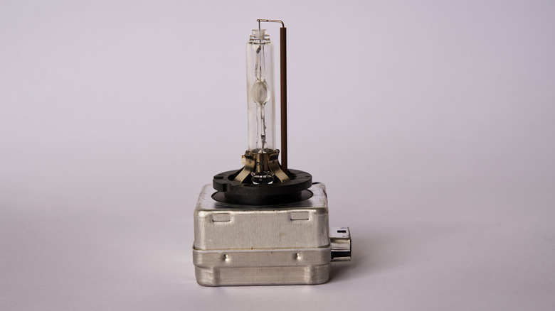 A close-up view of an HID or xenon headlight bulb