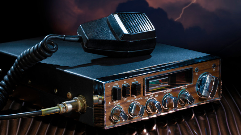 CB radio and microphone with a lightning storm behind