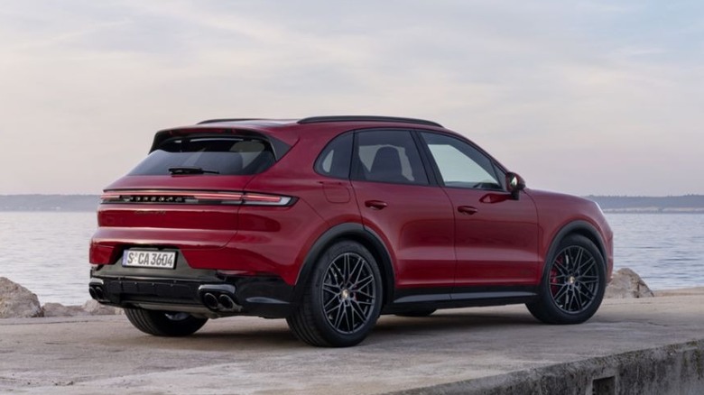 2025 Porsche Cayenne GTS in Granite Red parked on cement pier overlooking the water