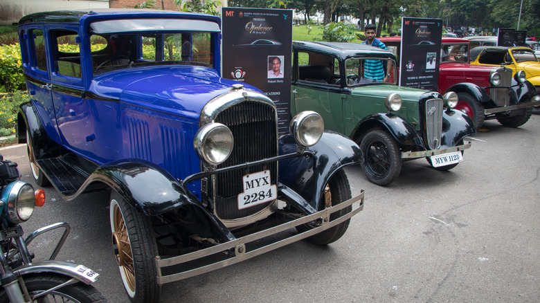 A 1930 Austin 7 vintage car parked alongside other vintage cars