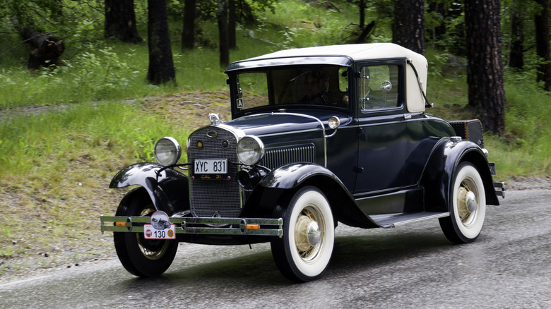 A Ford Model A Roadster on a road