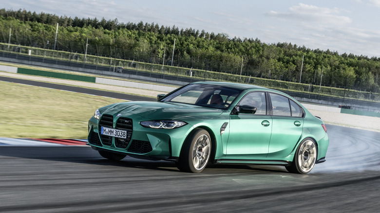 The G80-generation BMW M3 ripping a slide through a race track.