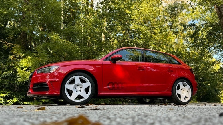 Audi A3 E-Tron PHEV parked in front of sparsely lit trees