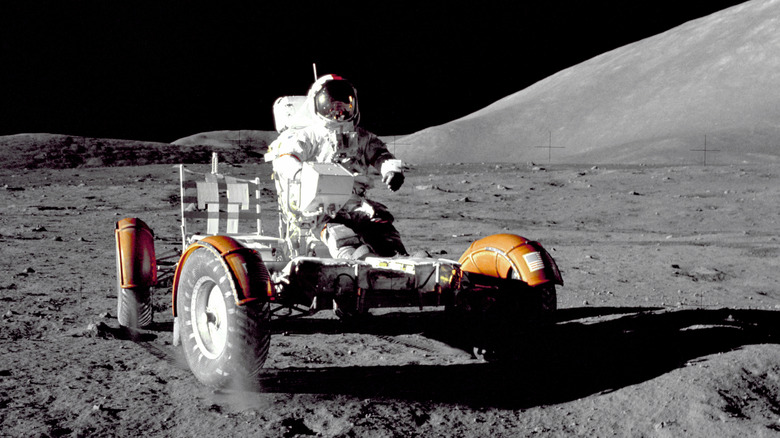 Astronaut Eugene A. Cernan, Apollo 17 mission commander, makes a short checkout of the Lunar Roving Vehicle during the early part of the first Apollo 17 extravehicular activity (EVA-1) at the Taurus-Littrow landing site. This view of the "stripped down" Rover is prior to loadup.