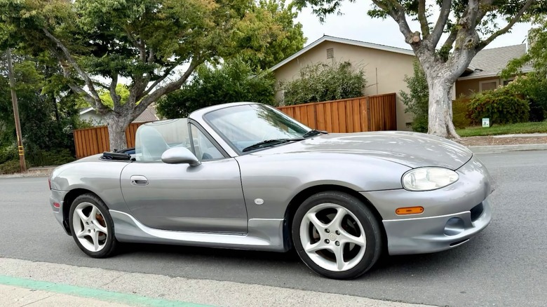 2003 Mazda MX-5 Miata 'Shinsen' edition passenger side with top down image