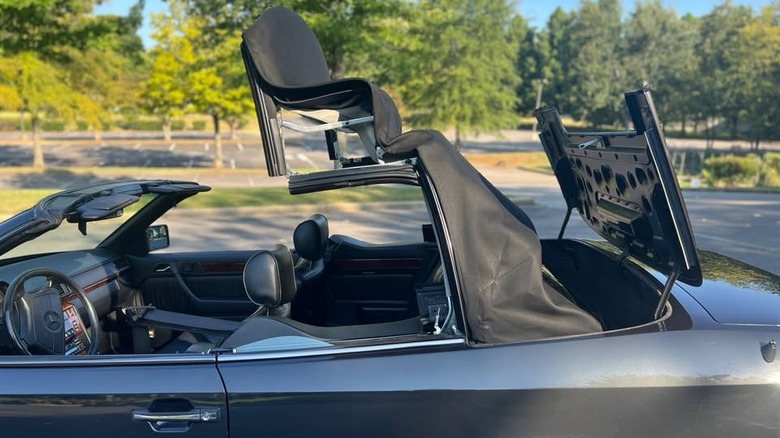 1994 Mercedes-Benz E320 Cabriolet convertible top in action image