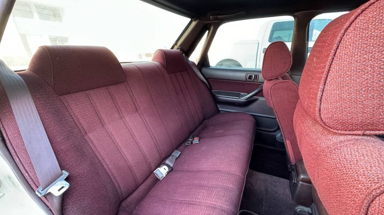 1989 Toyota Camry All-Trac rear bench seat in red cloth upholstery image