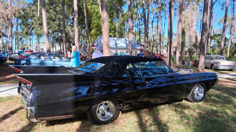 Custom 1967 Pontiac Grand Prix passenger side image showing its Caddy tail fins