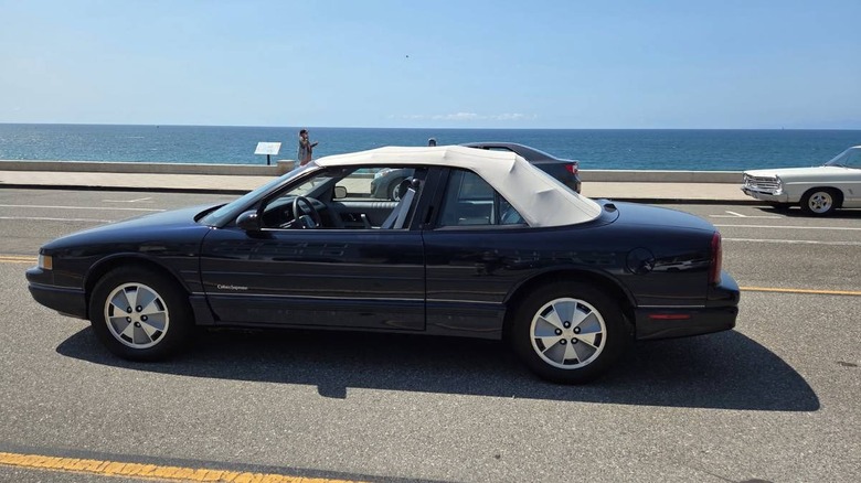 1991 Oldsmobile Cutlass Supreme convertible side view with convertible top up