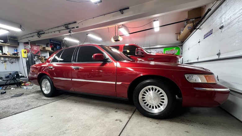 1999 Mercury Grand Marquis passenger side image parked in a garage