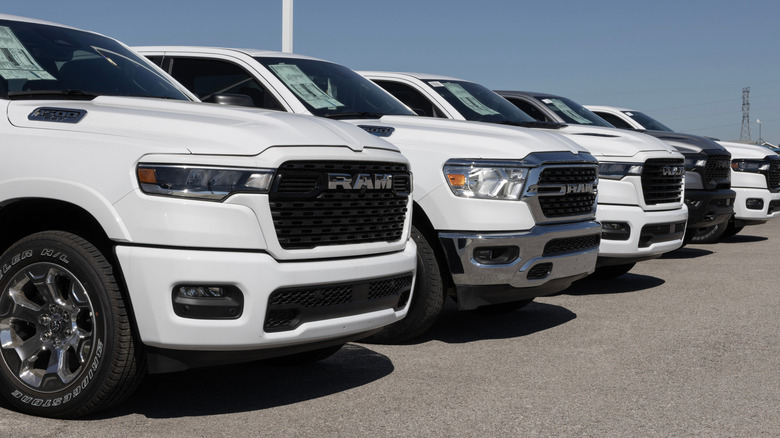 Ram 1500 display at a dealership. Ram offers the 1500 in Rebel, Laramie, Big Horn, and Tradesman models.