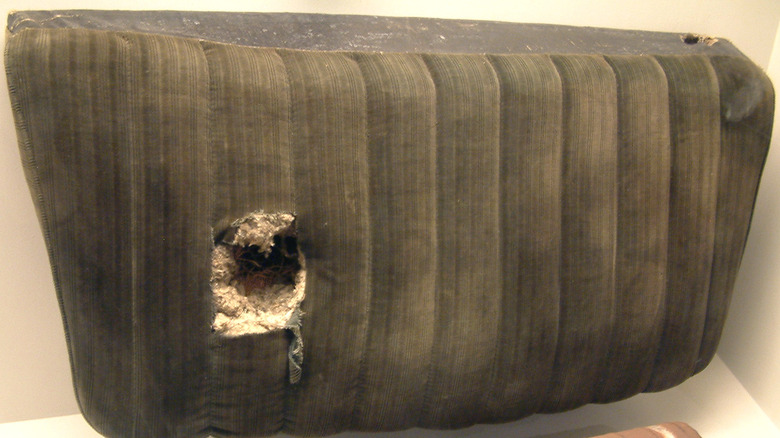 The muffler and seat cushion of the Pontiac coupe that a meteorite struck in Benld, Illinois
