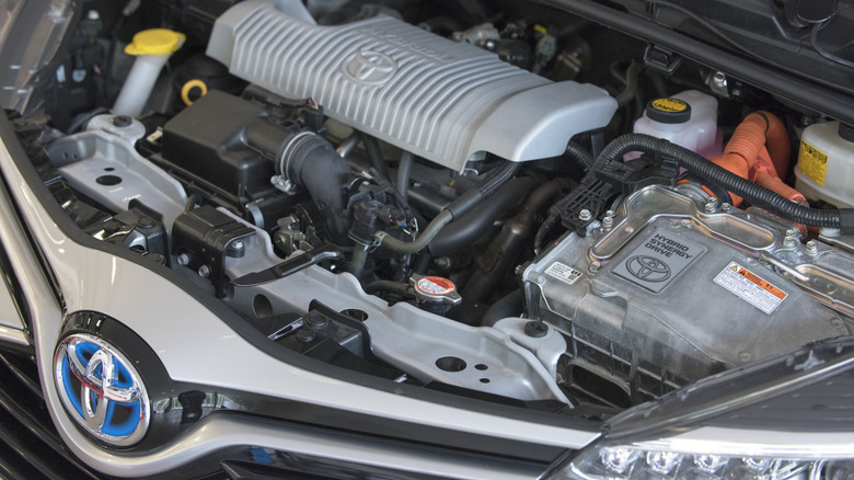 Closeup of a hybrid engine in a Toyota car.