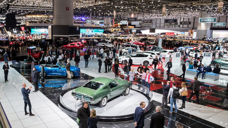 A top-down view of the 88th Geneva International Motor Show crowded with people and cars