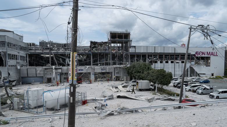 KUMAMOTO, JAPAN - JULY 29: The damaged facade of Aeon Mall Kumamoto is seen following an explosion in the wake of an earthquake on July 29, 2026 in Kashima, Kumamoto Prefecture, Japan.