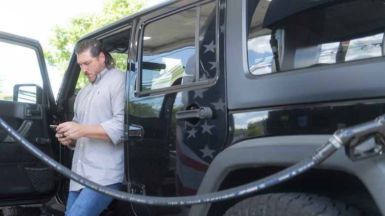 A customers gets gas at a Freedom Fuel Network gas station on July 8, 2026 in Dresher, Pennsylvania.