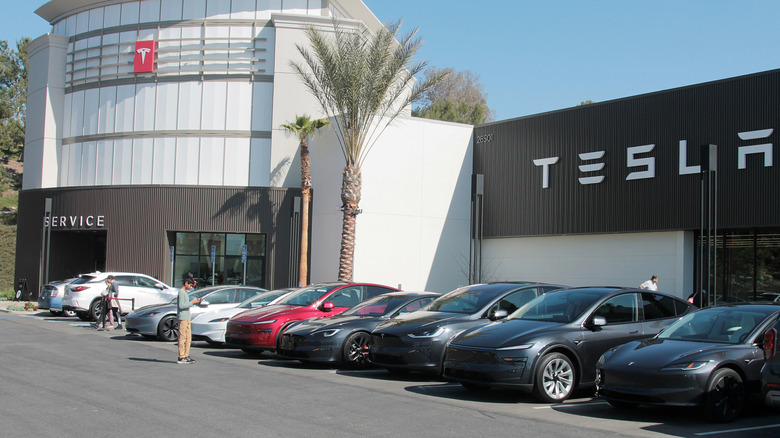 Tesla Electric Car Dealership. Tesla EV electric vehicles on display. Tesla products include electric cars, battery energy storage, solar panels.