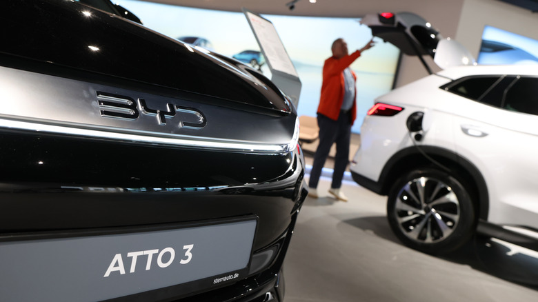 A imaginable customer inspects electrical cars of Chinese shaper BYD astatine a dealership connected May 23, 2025 successful Berlin, Germany.