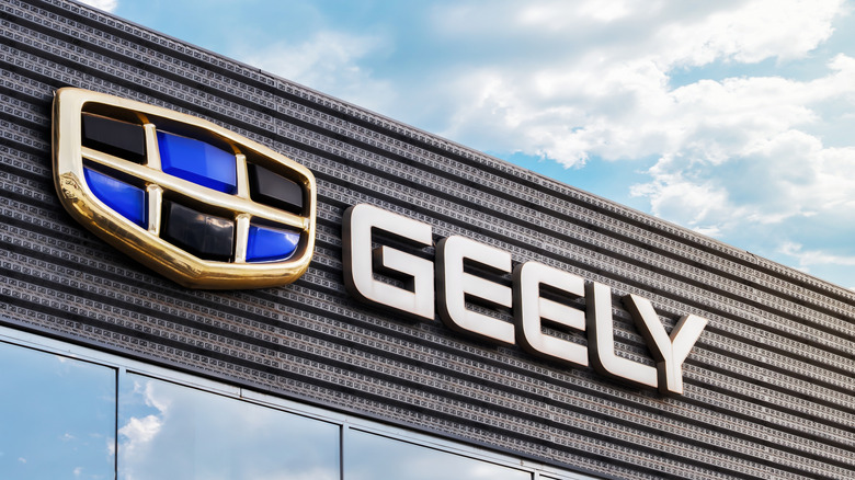 Krasnoyarsk, Russia , January 14, 2025: importance separated by commas without numbering: The logo of the automaker Geely on the facade of the dealership. Geely is a growing and powerful auto brand