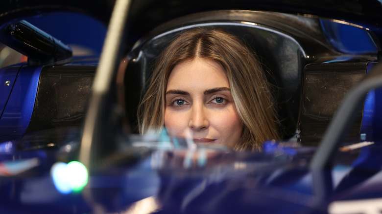 Emelia Hartford sitting in a Formula E race car