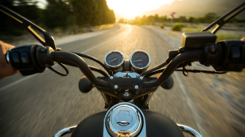 Motorcycle rider traversing a backroad
