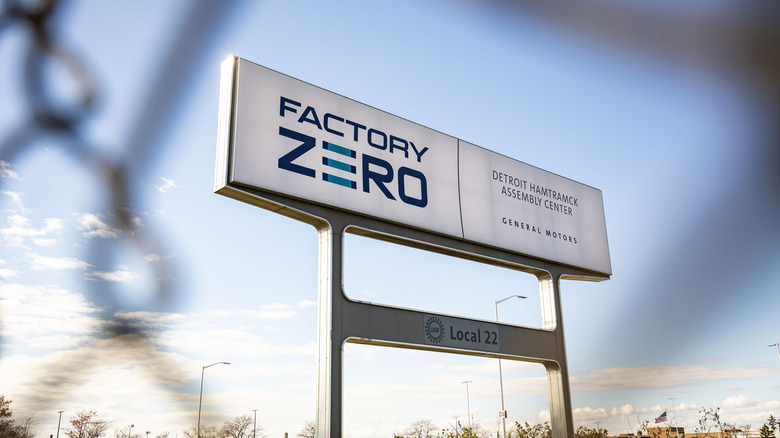 DETROIT, MICHIGAN - OCTOBER 29: A sign for General Motors' Factory Zero plant is seen on October 29, 2025 in Detroit, Michigan. General Motors announced today it will be laying off 3,300 hourly employees around the country at plants that make electric vehicles and batteries due to slowing EV consumer interest. GM's all-electric Factory Zero plant, which manufactures the Chevrolet Silverado EV and the GMC Sierra EV, among others, will be hit the hardest, with 1,200 workers to be laid off. (Photo by Bill Pugliano/Getty Images)