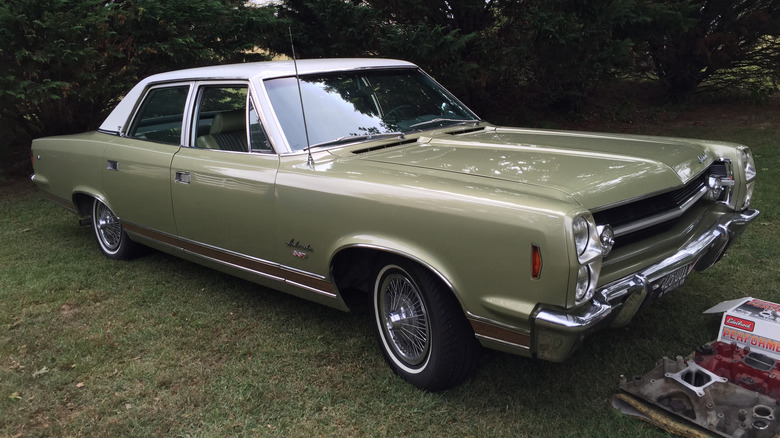 A green, 1968 AMC Ambassador SST sedan.