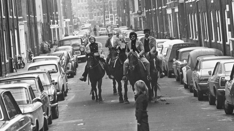 Four horsemen riding through the streets of Amsterdam on a 'motorless day', when cars are prohibited due to the oil crisis in the Middle East, 4th November 1973.