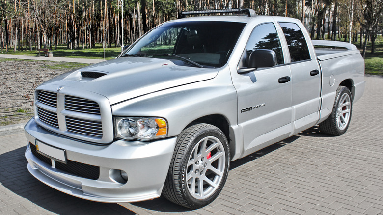 Silver Dodge Ram SRT-10 pickup truck sits parked outdoors.