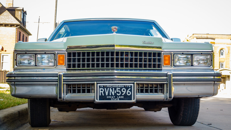 Front extremity of a 1970s Cadillac Fleetwood parked connected nan thoroughfare pinch Michigan plates
