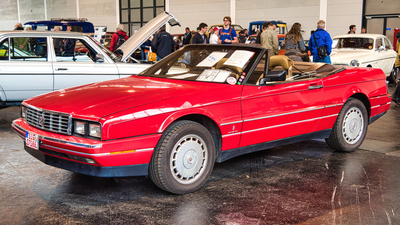Red Cadillac Allante pinch convertible apical down astatine a car show
