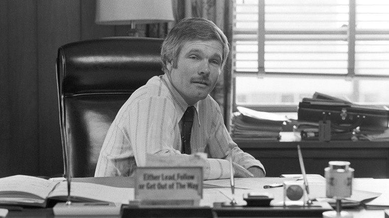 Ted Turner sitting at his desk in 1980.