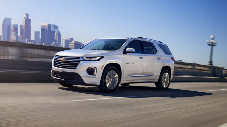 Driver front 3/4 view of 2023 Chevrolet Traverse driving on bridge