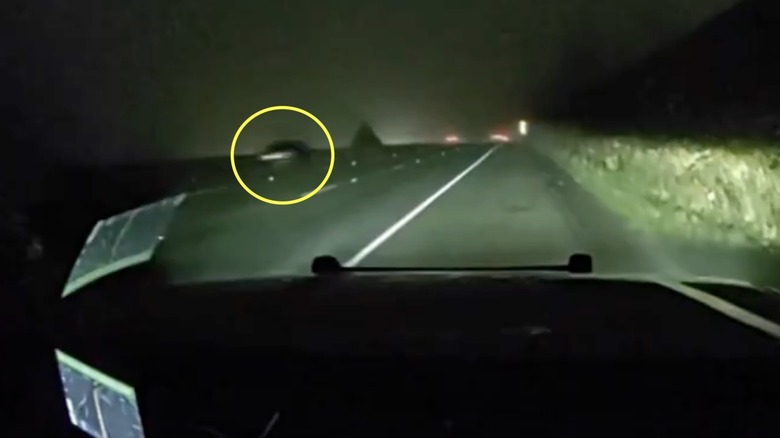 A car with its lights off speeds past a Washington State Trooper at 156 mph
