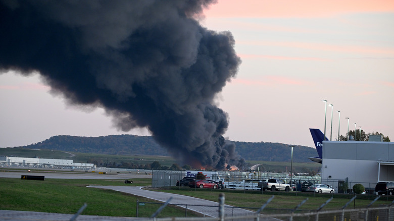 Smoke billows into the air after the UPS MD-11 crash