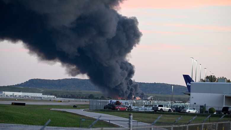 Smoke billows into the air after the UPS MD-11 crash