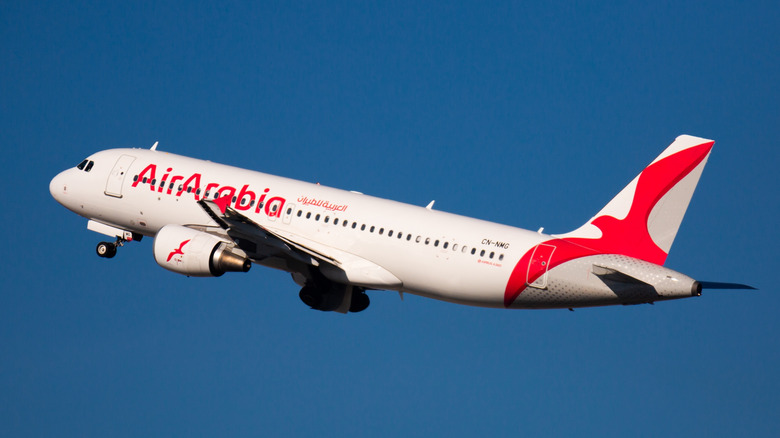 Airbus A320 with CN-NMG registration, Air Arabia Airlines, getting take off the runway at El Prat Airport (BCN)