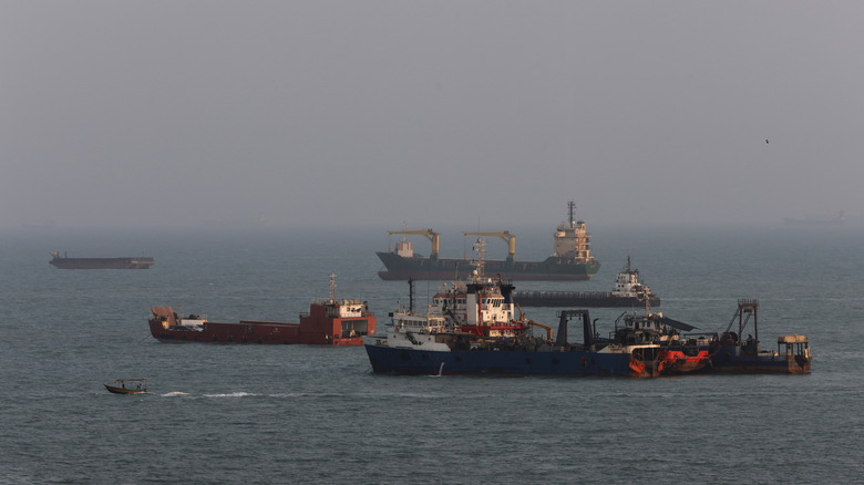 Ships are anchored in the Strait of Hormuz on August 10, 2026 off the coast of Bandar Abbas, Iran. In a recent statement, Iran's Supreme National Security Council said the vital waterway would not reopen until the United States corrects its behavior, demanding that the U.S. end its war on Iran and compensate the country for war damage, among other conditions.