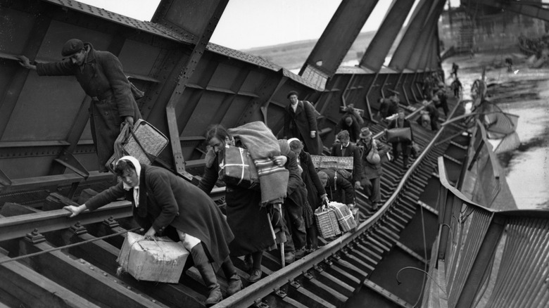 Germans trying to flee a town via a collapsed bridge as the Russian forces advanced in World War II.
