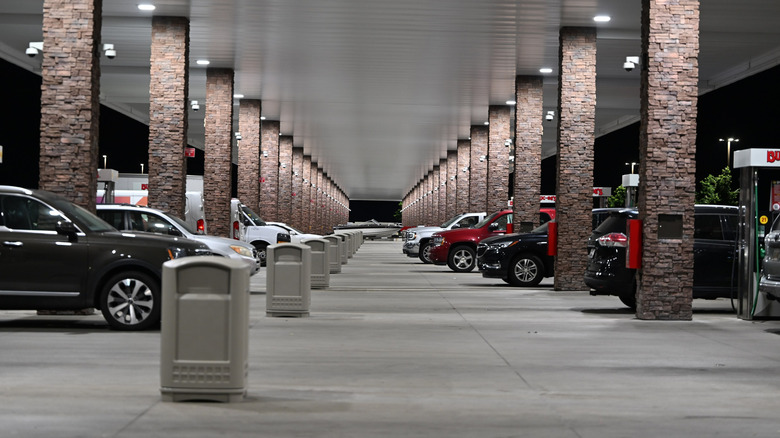 Buc-ee's gas pumps filled with cars at night.