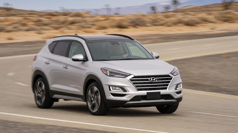 2021 Hyundai Tucson driving on a closed course roadway in the desert.