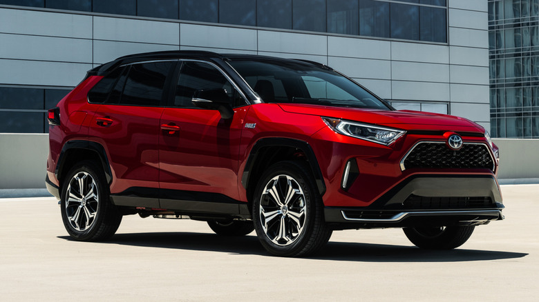 2021 Toyota RAV4 parked by modern buildings.