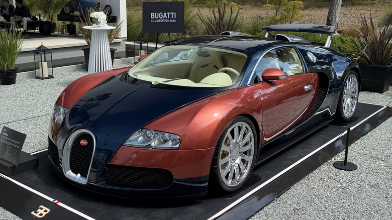 Front 3/4 view of an orange and blue Bugatti Veyron