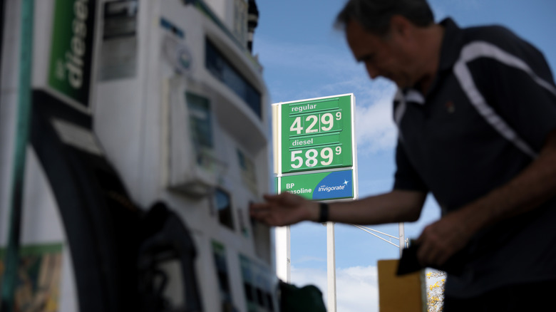 Carlos Ferre puts fuel in his vehicle at a gas station on April 06, 2026 in Miami, Florida.