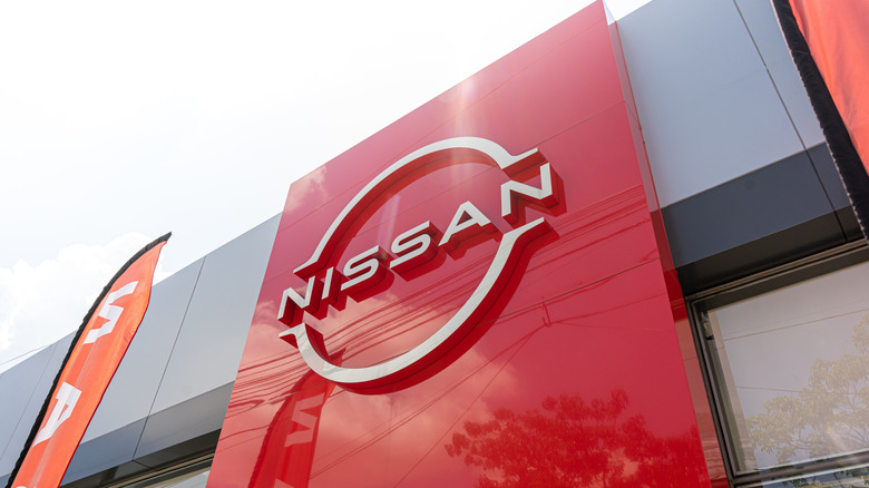 Nissan motor company logo in front of dealership building, Nissan is a Japanese multinational automobile company. Guadalajara, Jalisco, Mexico, August 24, 2024.