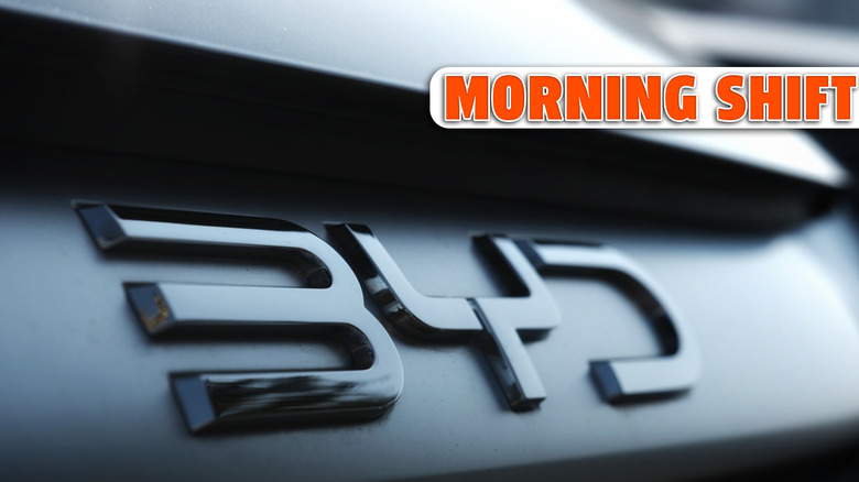 Close-up of a metallic 'BYD' emblem on the dark rear of a modern car, highlighting the sleek numbers and automotive detail. Photo taken in Cigombong, West Java, Indonesia in 07 Jun 2025