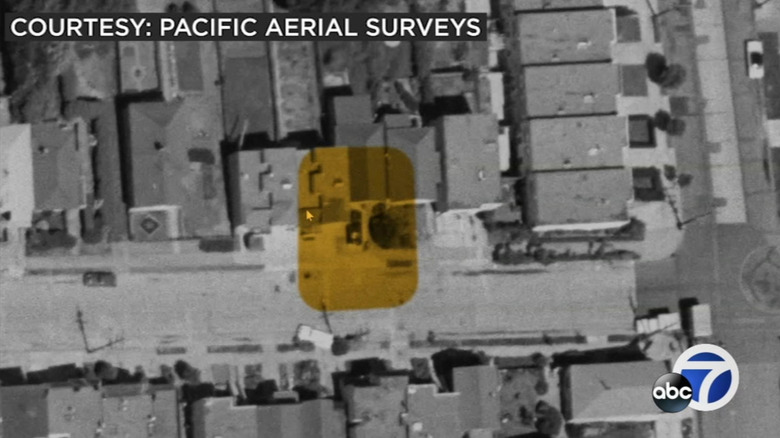 An aerial photo of a car parked on the concrete pad at the Craines' address in 1958.