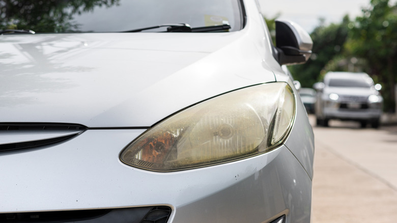 A close-up view of a foggy car headlight